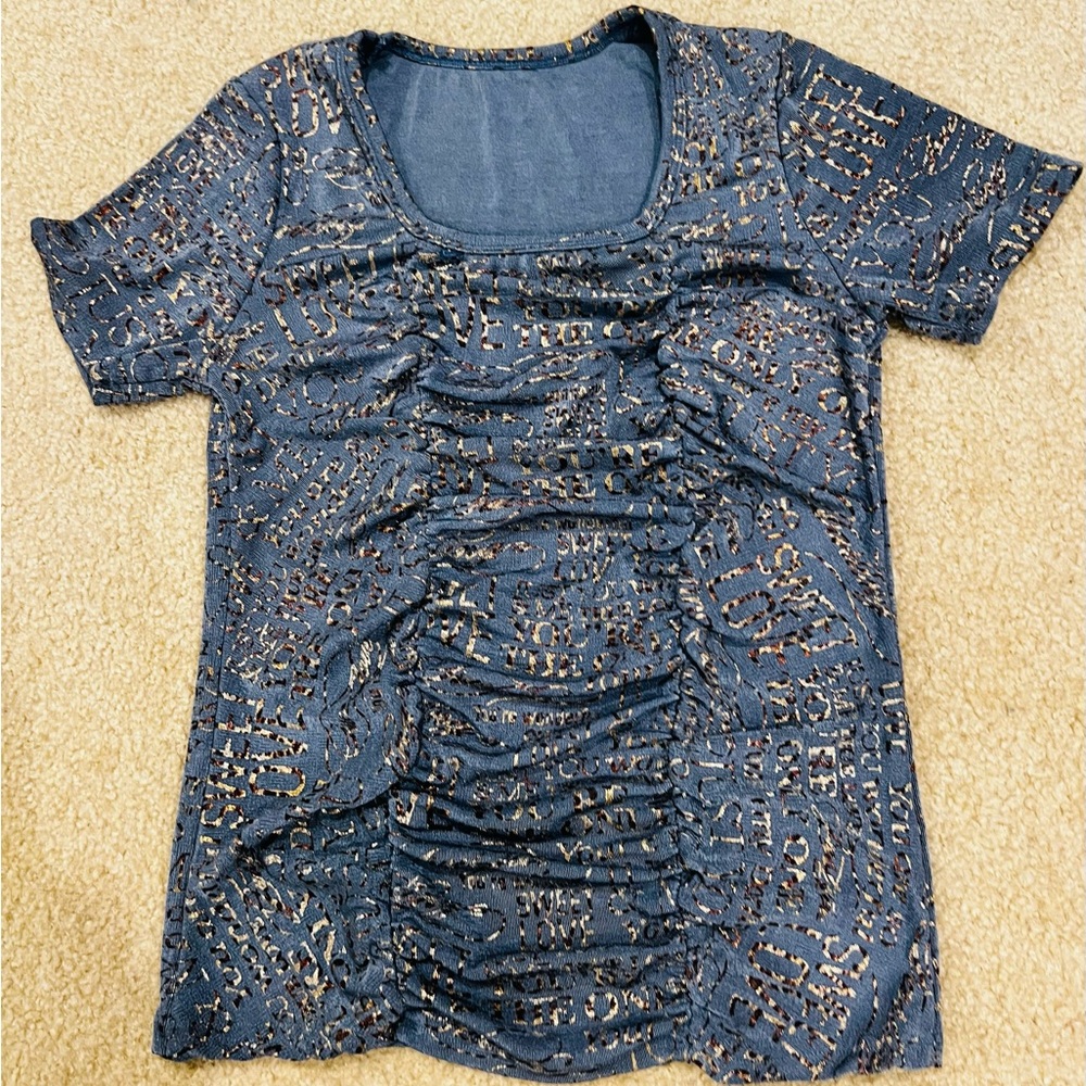 Stretchy shirt. New. Wearable from size XS to size XL.